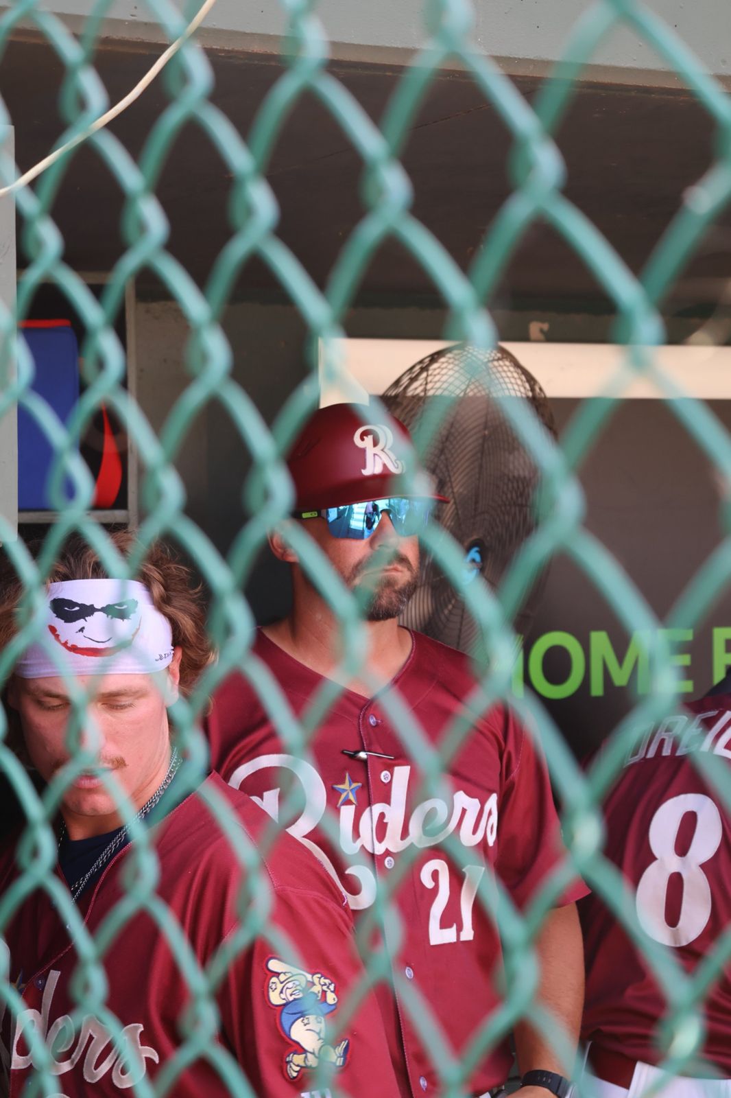 Rough Riders dugout through the fence