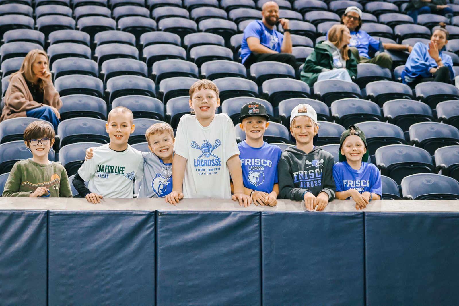 Young Frisco lacrosse fans at the rail