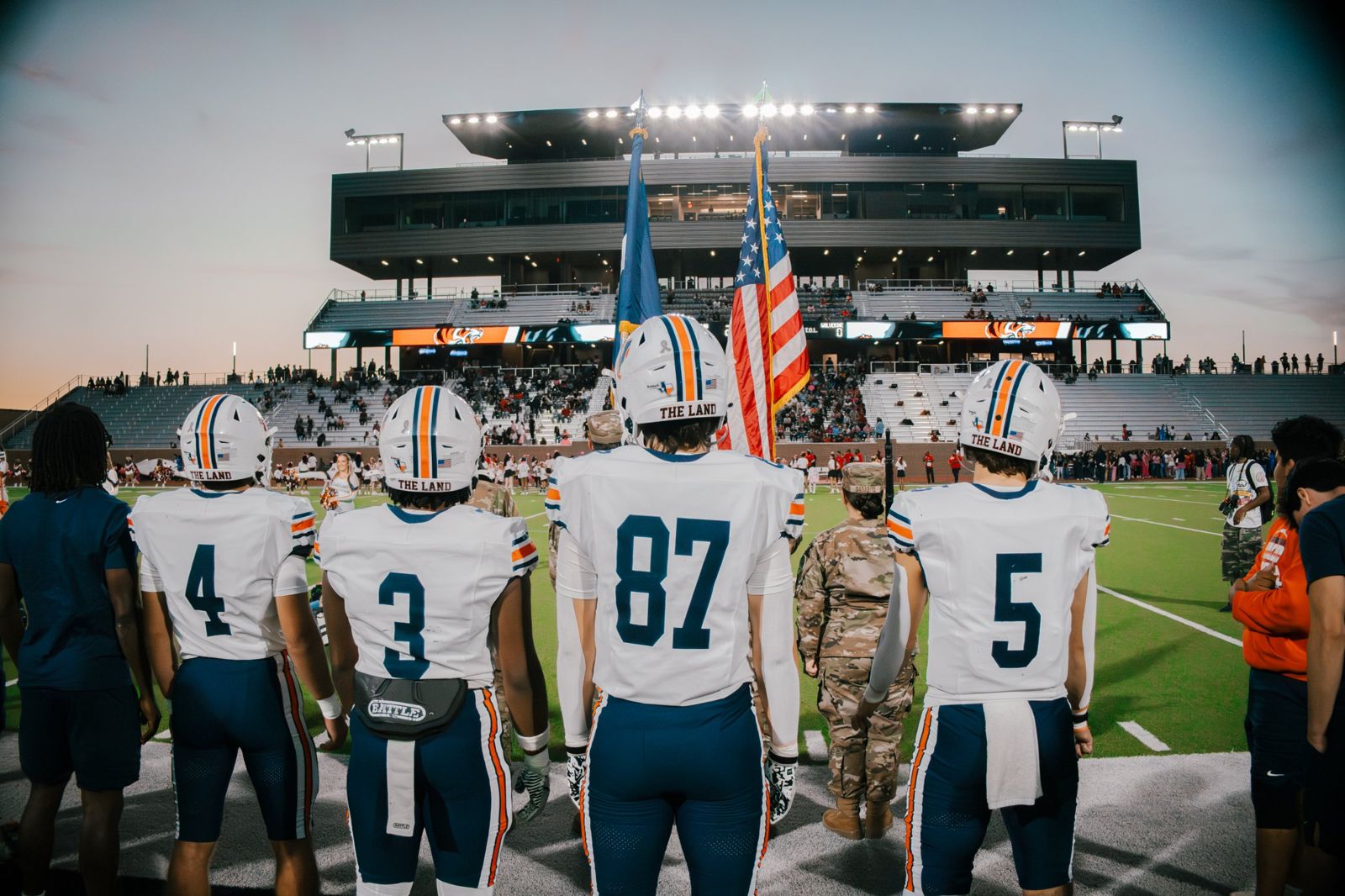 Wakeland players lined up for the anthem at sunset